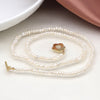 Cadwen Perlau | Ivory Freshwater Pearl and Golden Flower Clasp Necklace