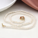 Cadwen Perlau | Ivory Freshwater Pearl and Golden Flower Clasp Necklace