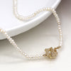 Cadwen Perlau | Ivory Freshwater Pearl and Golden Flower Clasp Necklace