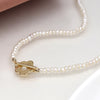 Cadwen Perlau | Ivory Freshwater Pearl and Golden Flower Clasp Necklace