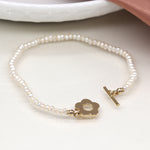 Breichled Perlau | Ivory Freshwater Pearl and Golden Flower Clasp Bracelet