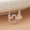 Cadwen Dwy Galon | Silver Plated Topsy Turvy Hearts Necklace