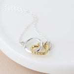 Cadwen Arian ac Aur - Calon a Chylchyn | Silver & Gold Necklace - Linked Heart & Hoop