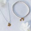 Cadwen Lleuad a Sêr Plentyn - Aur | Moon & Stars Children’s Necklace – Gold